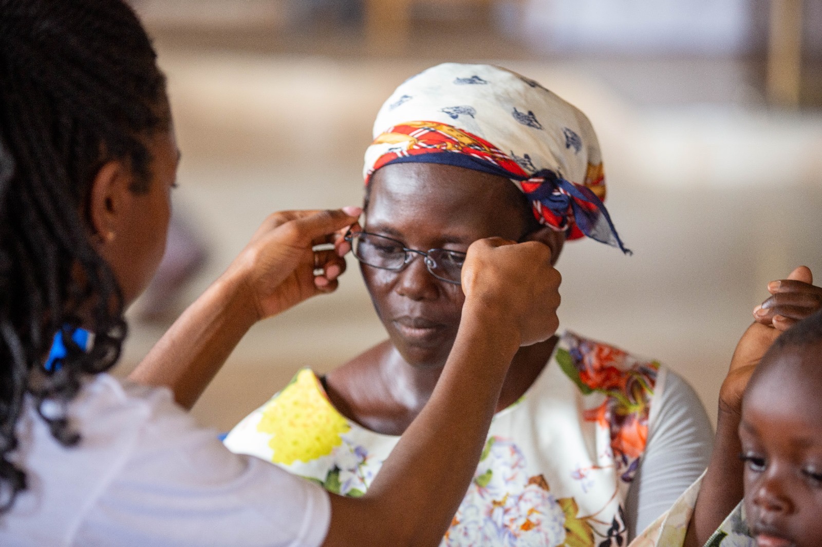 Fitting glasses for a community member