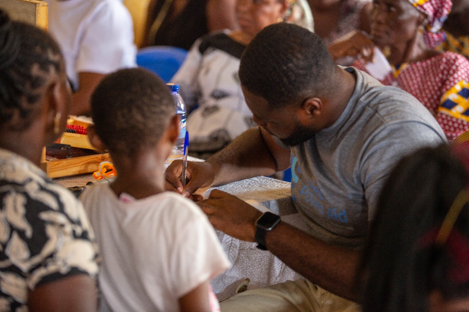 Volunteer assisting child patient